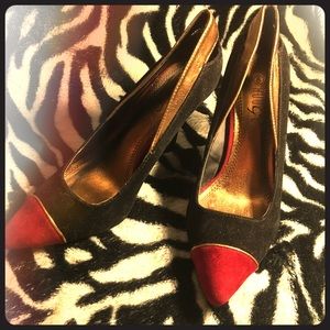 Black gold and red suede stilettos.